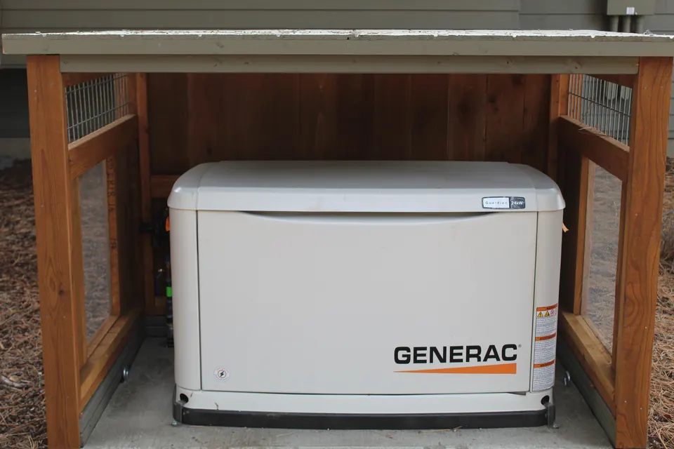 A standby generator inside a slatted cedar enclosure